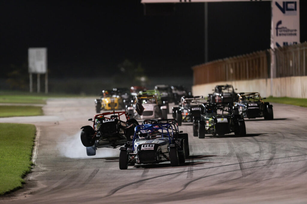 At-the-start-of-the-second-Floodlit-Enduro-Justin-Maloney-driving-the-Seven-420R-guest-car-was-an-early-retirement-after-riding-up-over-the-rear-wheel-of-the-car-in-front-at-the-first-corner.